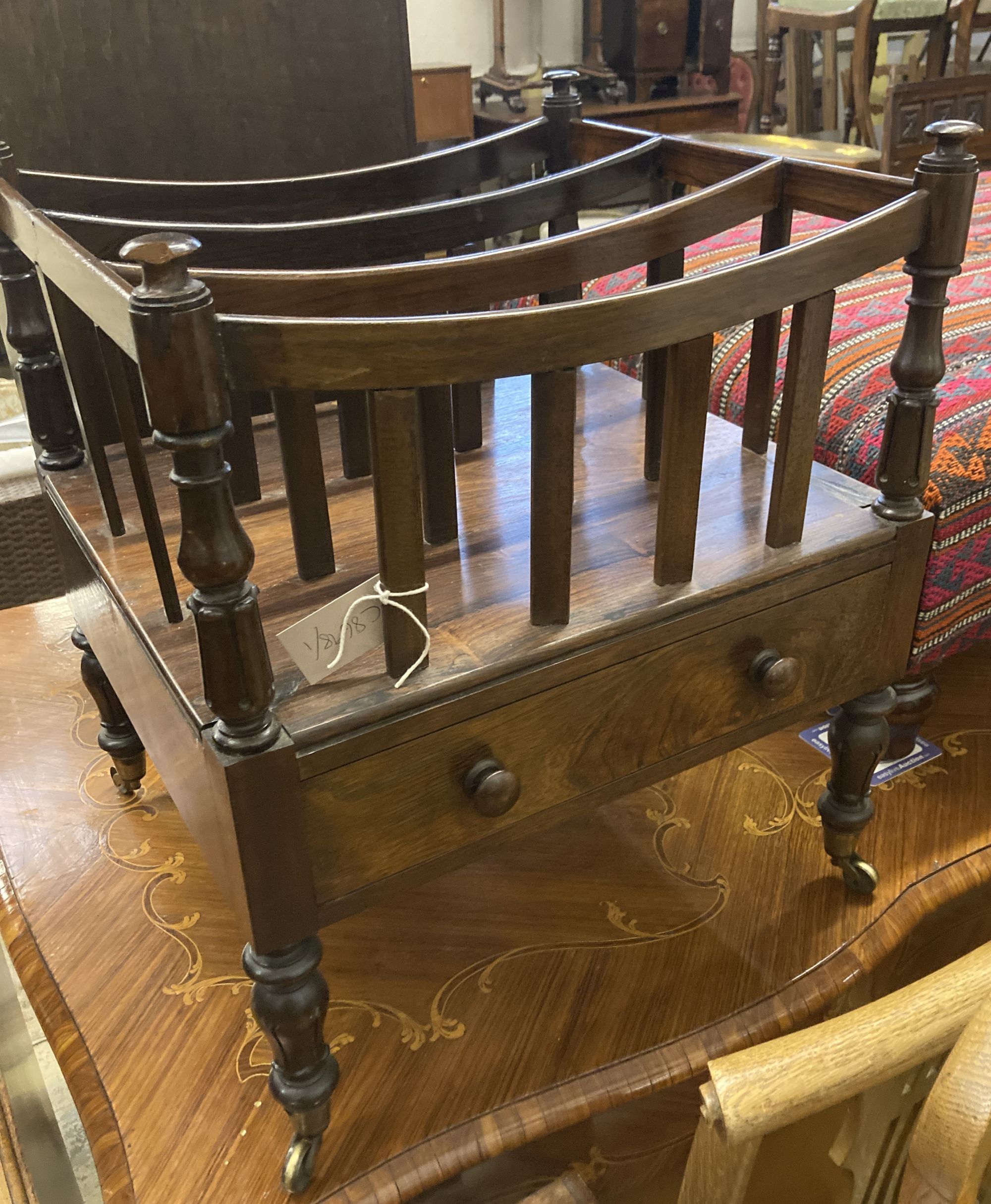 An early Victorian rosewood Canterbury, width 48cm, depth 43cm, height 56cm